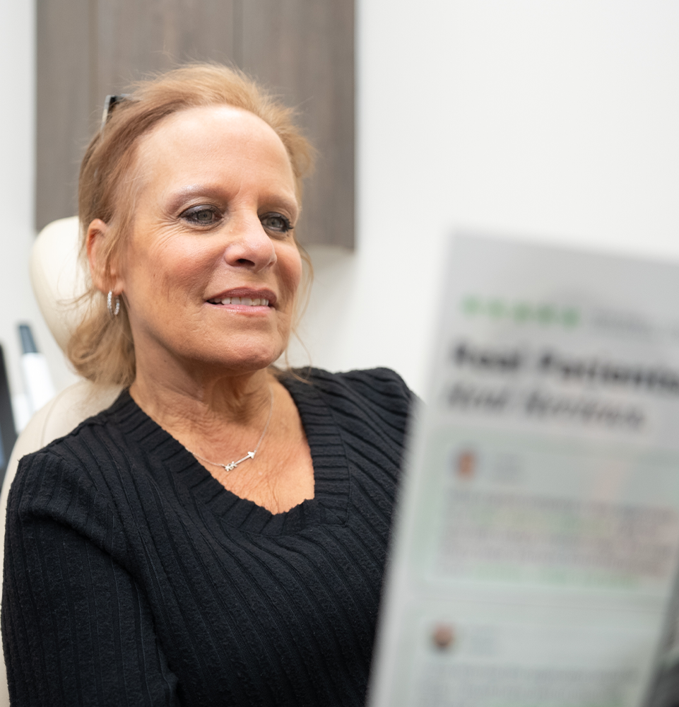 patient holding a financing brochure